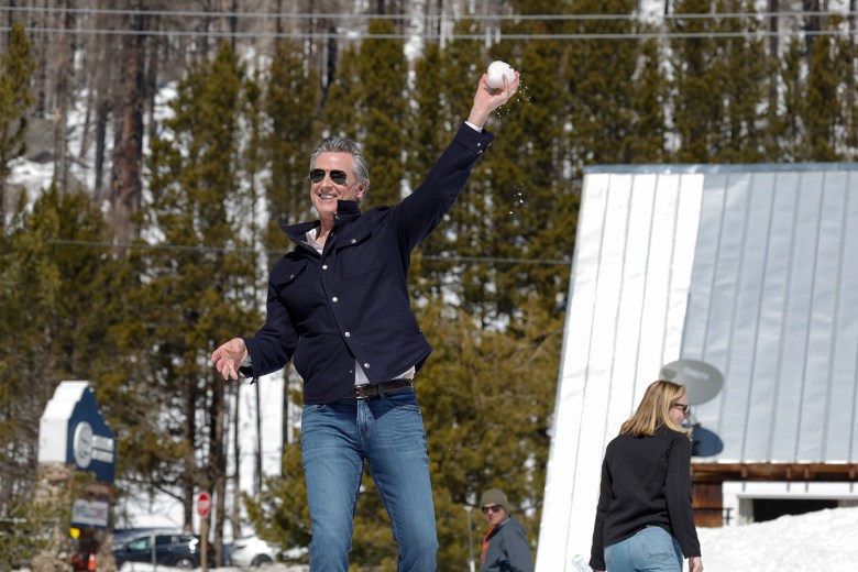 Gov. Gavin Newsom tosses a snowball after the California Department of Water Resources Snow Surveys and Water Supply Forecasting Unit conducted the fourth media snow survey of the 2024 season at Phillips Station in the Sierra Nevada, on April 2, 2024. Photo by Fred Greaves, California Department of Water Resources