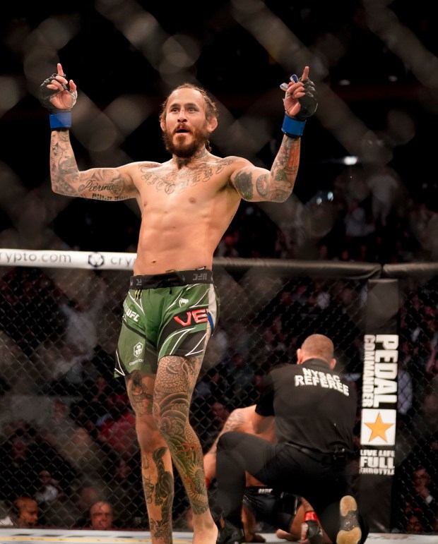 Marlon Vera reacts after knocking out Frankie Edgar in the third round of their bantamweight fight at UFC 268 on Nov. 6, 2021, in New York. (AP Photo/Corey Sipkin)