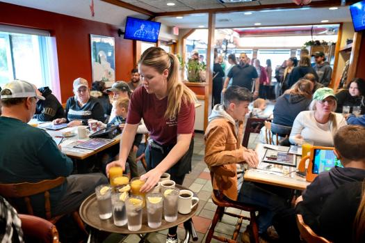 FILE – Waitress Rachel Gurcik serves customers at the Gateway Diner in Westville, Pa. on Oct. 22, 2023. On Friday, April 5, 2024, the U.S. government issues its March jobs report. (Tom Gralish/The Philadelphia Inquirer via AP, File)
