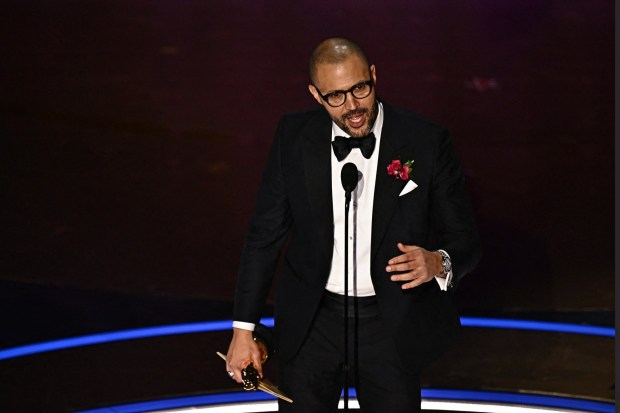 Writer Cord Jefferson accepts the award for Best Adapted Screenplay for "American Fiction" onstage during the 96th Annual Academy Awards at the Dolby Theatre in Hollywood, California on March 10, 2024. (Photo by PATRICK T. FALLON/AFP via Getty Images)