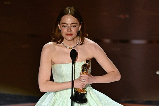 Actress Emma Stone accepts the award for Best Actress in a Leading Role for "Poor Things" onstage during the 96th Annual Academy Awards at the Dolby Theatre in Hollywood, California on March 10, 2024. (Photo by PATRICK T. FALLON/AFP via Getty Images)