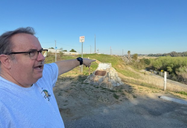 In Riverside's Martha McLean-Anza Narrows Park, Steve Lech points toward the point where Juan Bautista de Anza crossed the Santa Ana River in 1774. De Anza was the first outsider to document a visit through the Inland Empire. (Photo by David Allen, Inland Valley Daily Bulletin/SCNG)