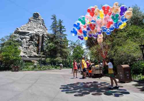 A Disneyland employee sells balloons near the Matterhorn Bobsleds at Disneyland in Anaheim, CA, on Friday, June 15, 2018. (Photo by Jeff Gritchen, Orange County Register/SCNG)
