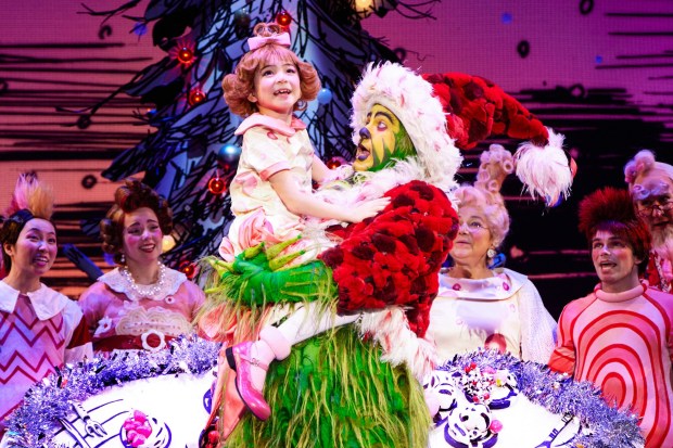 James Schultz as the Grinch and Aerina DeBoer as Cindy-Lou Who appear in a scene from "Dr. Seuss' How the Grinch Stole Christmas, The Musical." (Photo by Jeremy Daniel)