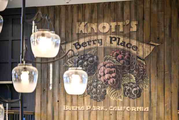 A graphic that nods to the original name of Walter Knott's berry stand hangs above the front desk of the remodeled Knott's Hotel in Buena Park, CA, on Thursday, Feb. 29, 2024. (Photo by Jeff Gritchen, Orange County Register/SCNG)