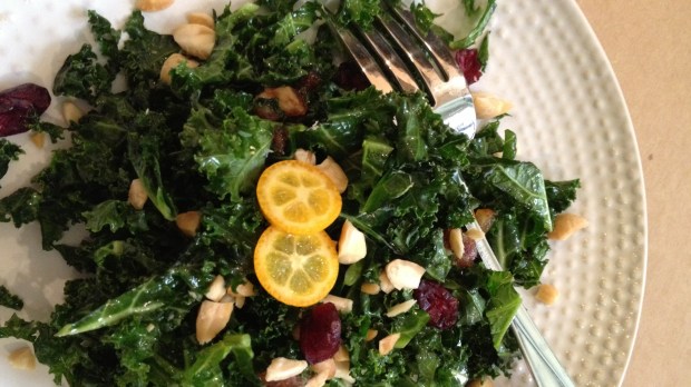 This kale salad is enlivened with dates, dried cranberries, maple syrup and almonds. (Photo by Cathy Thomas)
