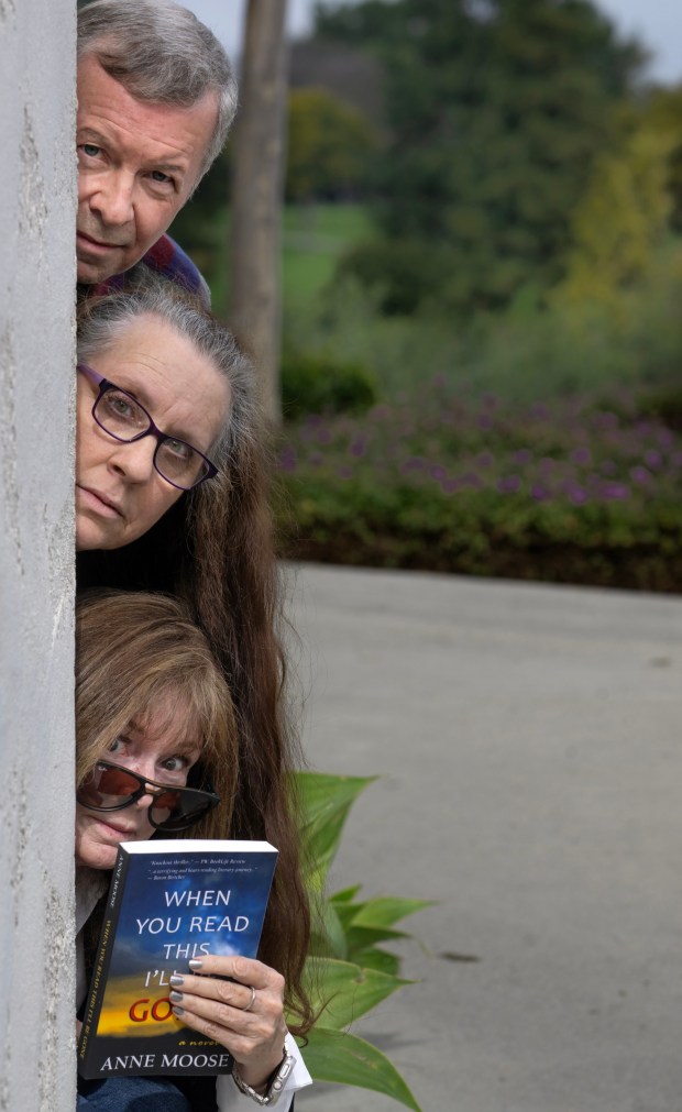 Mystery writer and President of the Orange County chapter of Sisters in Crime, Maddie Margarita, bottom, with club Vice President Sherry Clitheroe, and Treasurer Lance Charnes, in Laguna Woods on Saturday, Feb. 17, 2024. (Photo by Mindy Schauer, Orange County Register/SCNG)