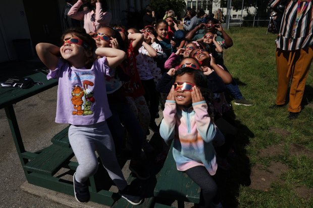 Children from the Willard Children Center gaze at the solar eclipse during the Pasadena Unified School District's Center for Independent Study solar eclipse viewing party for students from various schools and programs at its Wilson campus in Pasadena on Monday, April 8, 2024. While California was not in the path of totality, viewers in Pasadena and the rest of the state saw a partial blocking on the sun. (Photo by Trevor Stamp, Contributing Photographer)