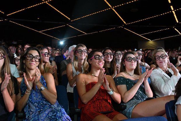NEW YORK, NY - SEPTEMBER 07: Audience members wear Iris Apfel's glasses as Macy's Presents Fashion's Front Row kicks-off New York Fashion Week at The Theater at Madison Square Garden on September 7, 2016 in New York City. (Photo by Slaven Vlasic/Getty Images for Macy's)
