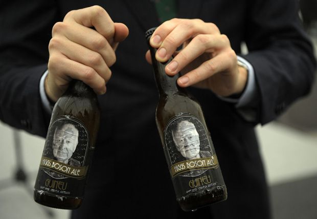A picture taken on October 24, 2013 shows beer bottles with label in homage to British physicist Peter Higgs in Oviedo. Englert, Higgs and CERN have been awarded the 2013 Prince of Asturias Award for Technical and Scientific Research. AFP PHOTO / MIGUEL RIOPA (Photo credit should read MIGUEL RIOPA/AFP via Getty Images)